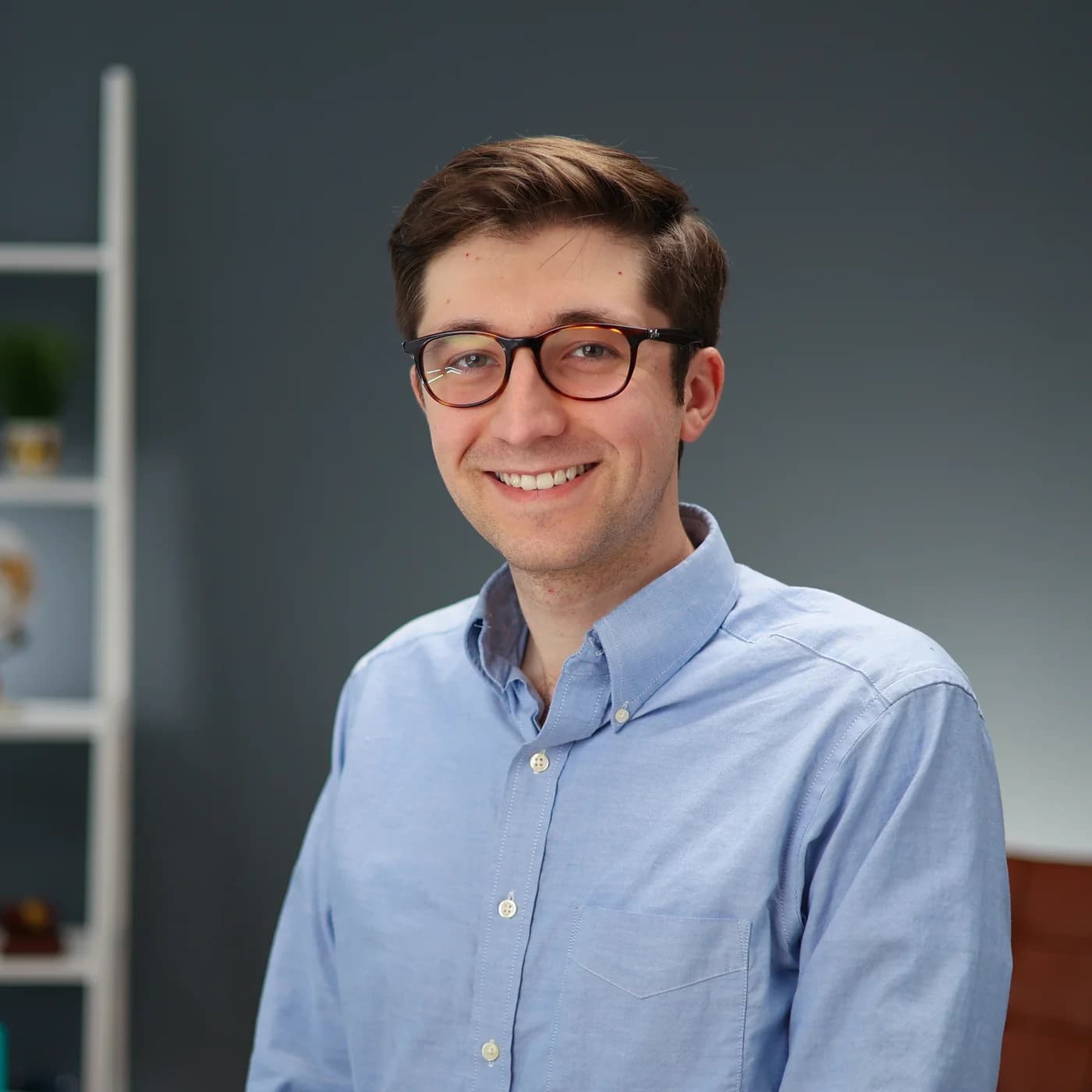James Williams, Partner at Tingen Law, wearing glasses and a light blue button-up shirt